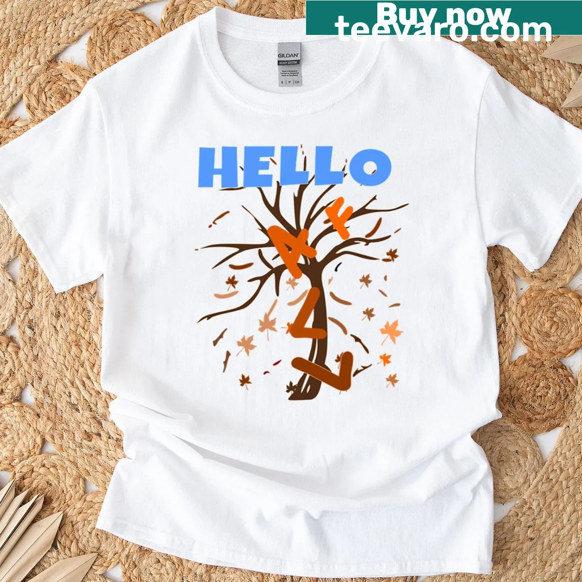 Autumn-themed t-shirt with a whimsical tree and floating letters — on a men's t-shirt