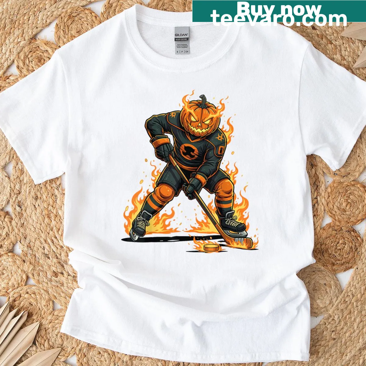 Halloween-themed T-shirt with hockey pumpkin face design — on a men's t-shirt