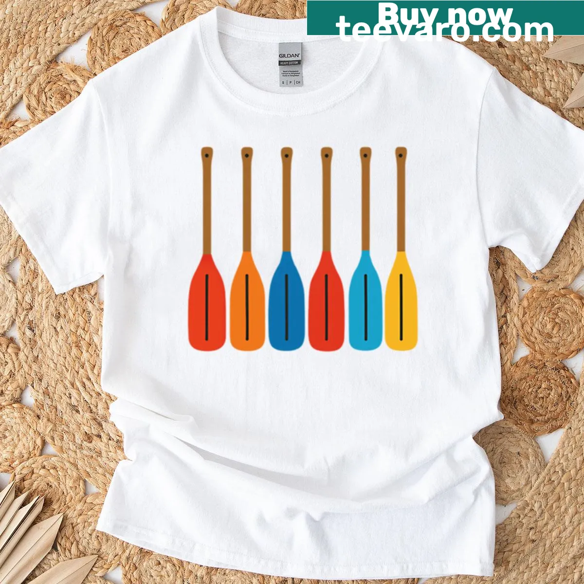 Vintage-style T-shirt featuring crossed oars against a water backdrop — on a men's t-shirt