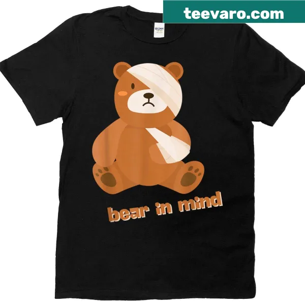 T-shirt featuring a sad bandaged teddy bear graphic