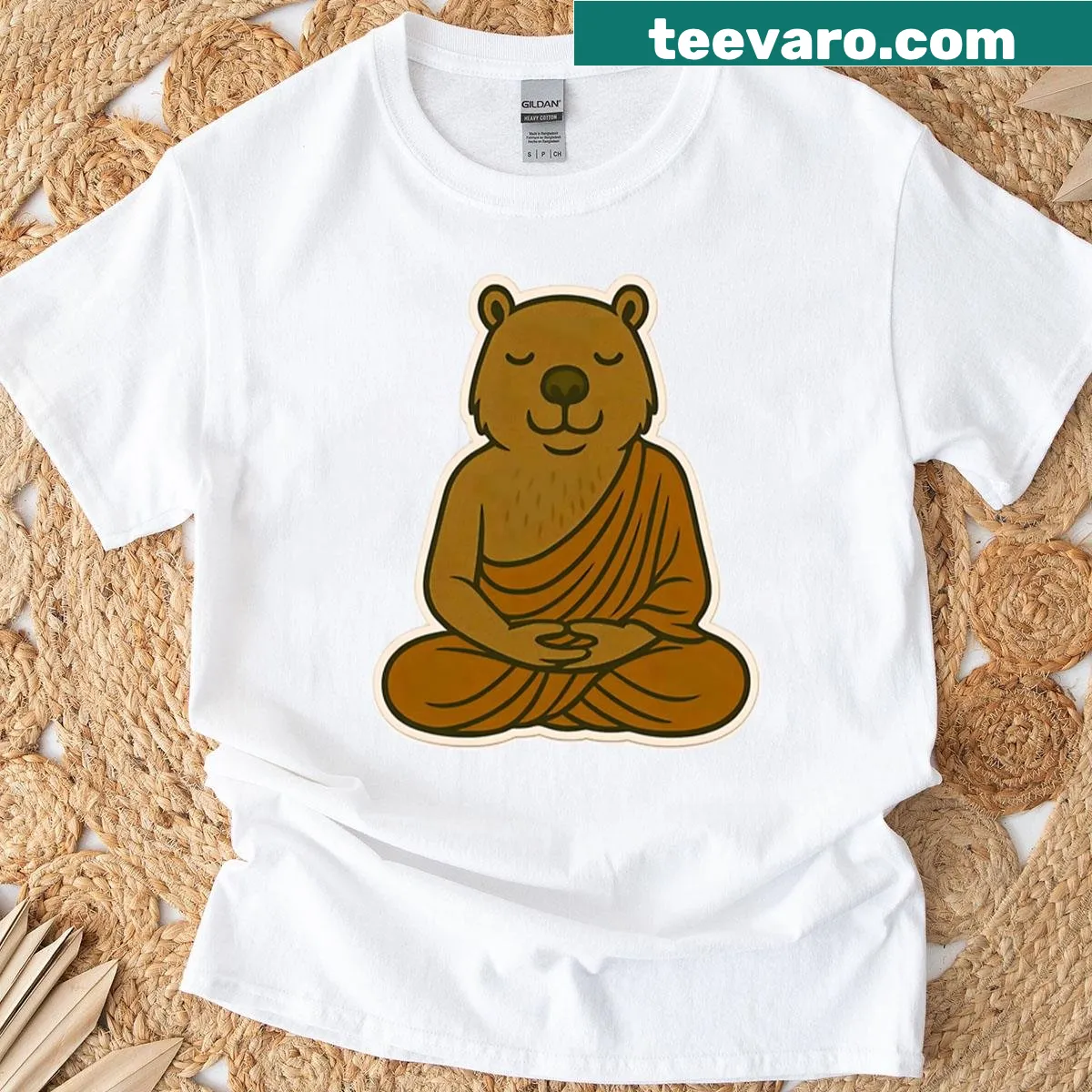Capybara meditating under a Buddha illustration on a t-shirt — on a men's t-shirt