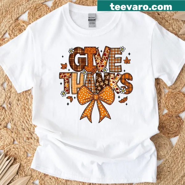 Patchwork 'Give Thanks' lettering with bow on a T-shirt
