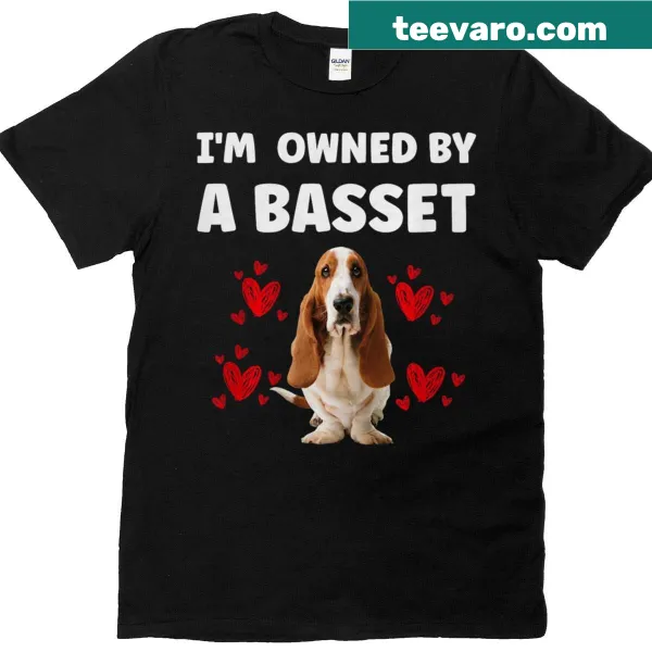 Cute shirt declaring ownership by a Basset Hound dog.