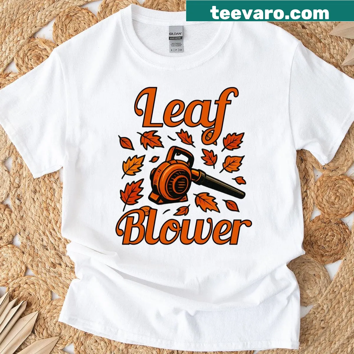 T-shirt featuring an illustration of a woman using an electric leaf blower — on a men's t-shirt