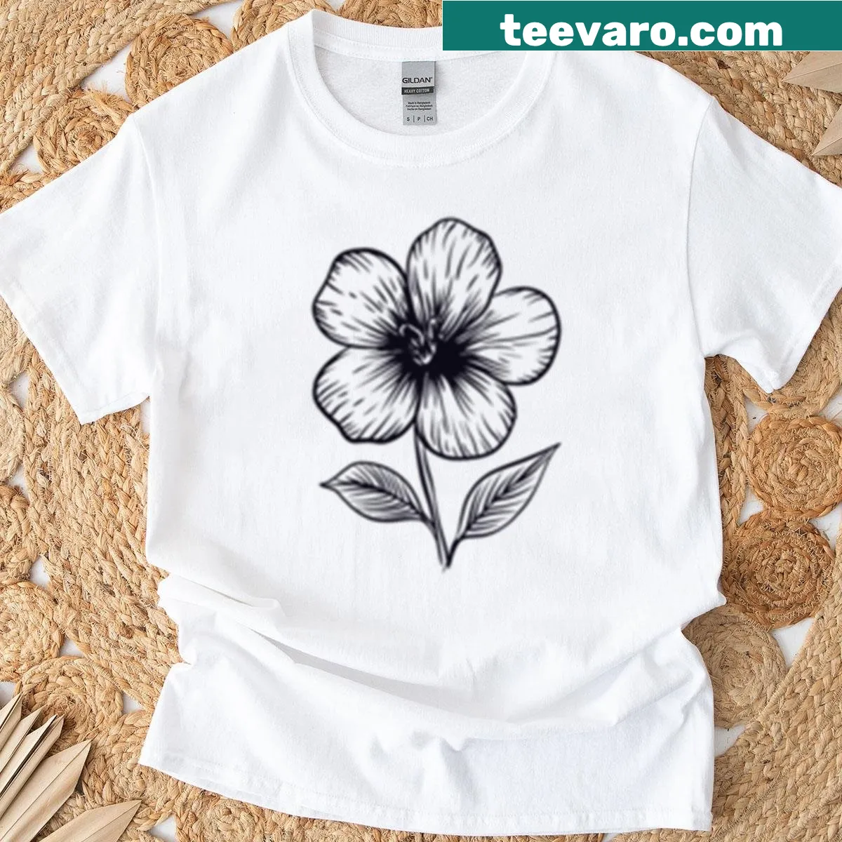 Minimalist line art flower design on black and white T-shirt — on a men's t-shirt