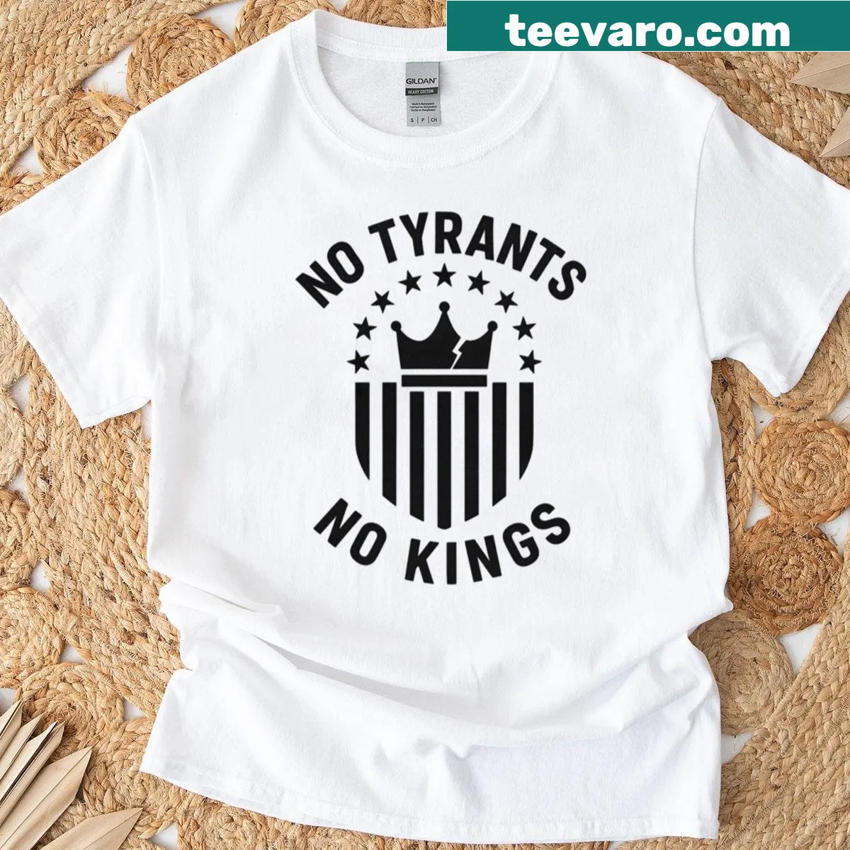 Minimalist badge graphic with 'No Tyrants No Kings' text — on a men's t-shirt