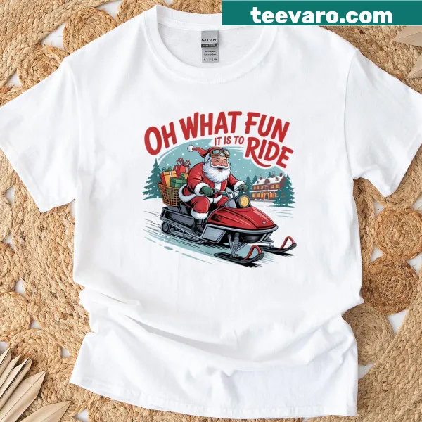 Festive Christmas T-shirt featuring the slogan about riding with Santa on a snowmobile.