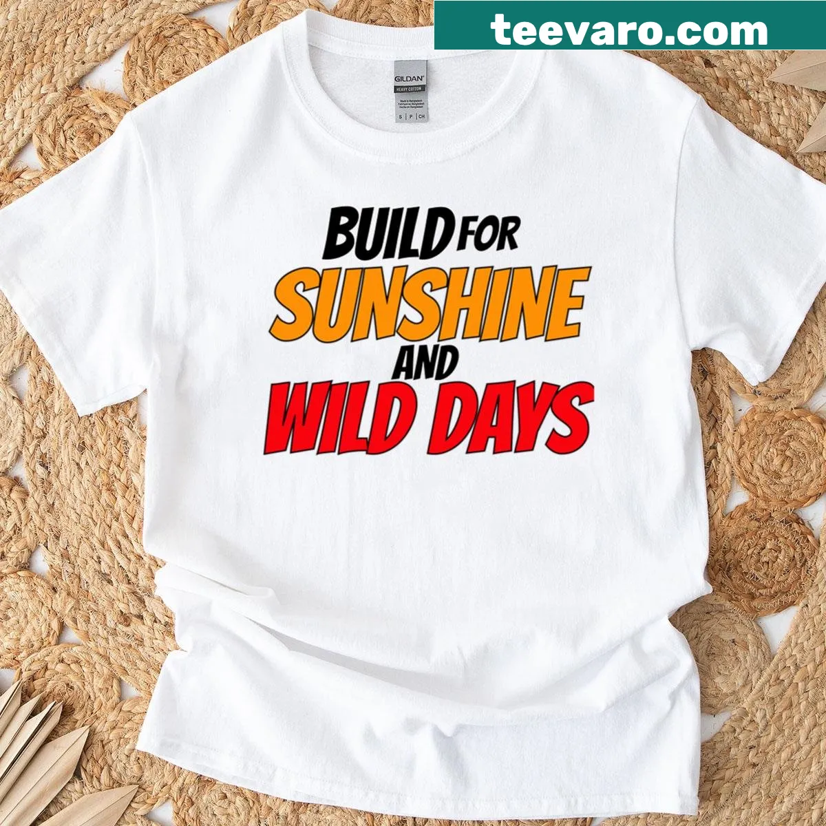 T-shirt featuring a summer design with the phrase Build For Sunshine And Wild Days — on a men's t-shirt