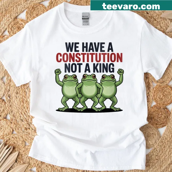 Shirt with the phrase 'We Have A Constitution Not A King' featuring frog illustrations