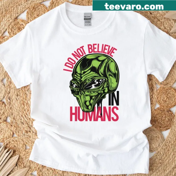 Skeptical alien graphic on humorous T-shirt about humans.