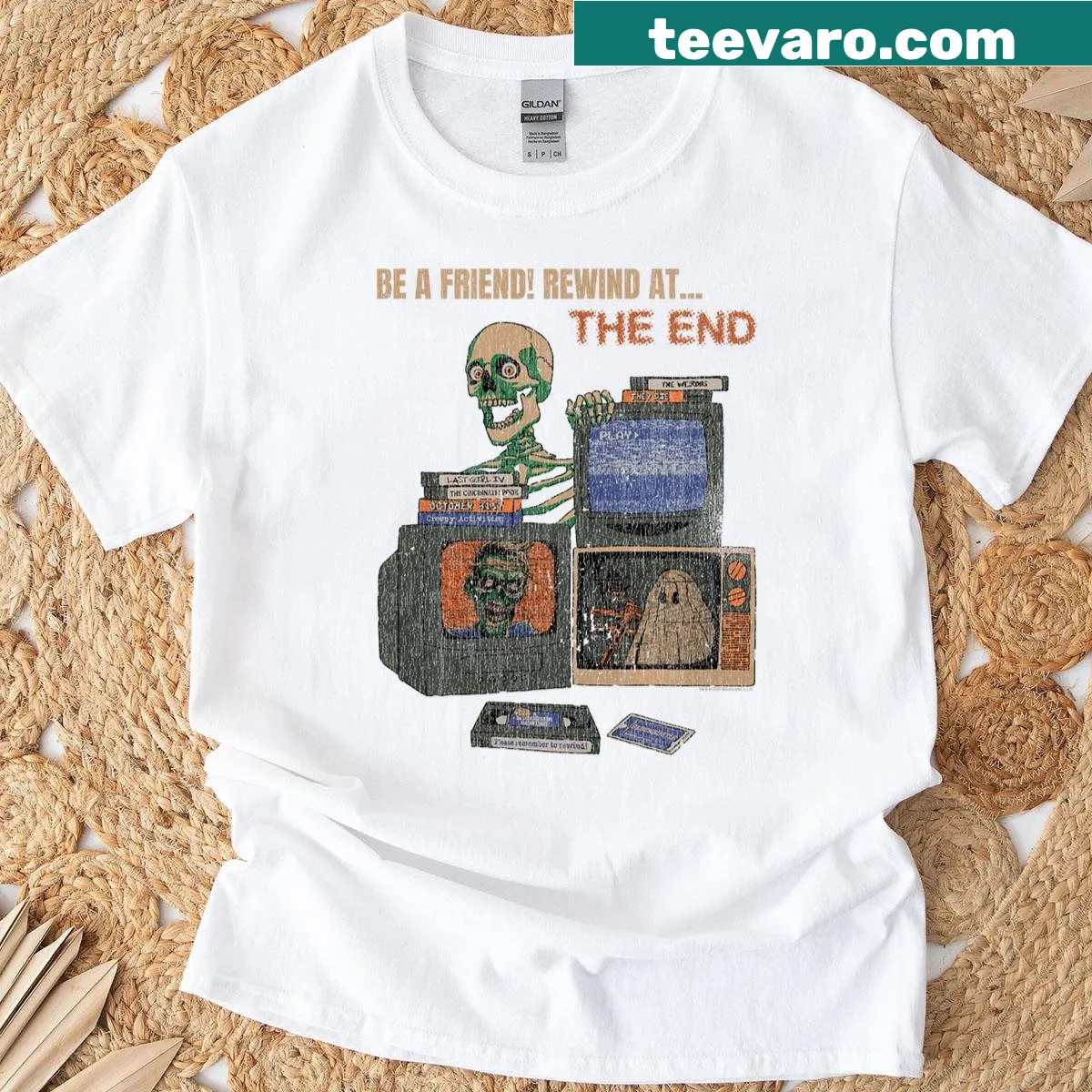 Vintage skeleton design holding a film reel for horror movie fans — on a men's t-shirt