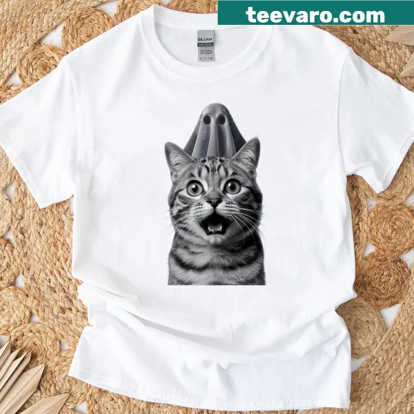 Cat taking a selfie with a ghost graphic on an oversized T-shirt.