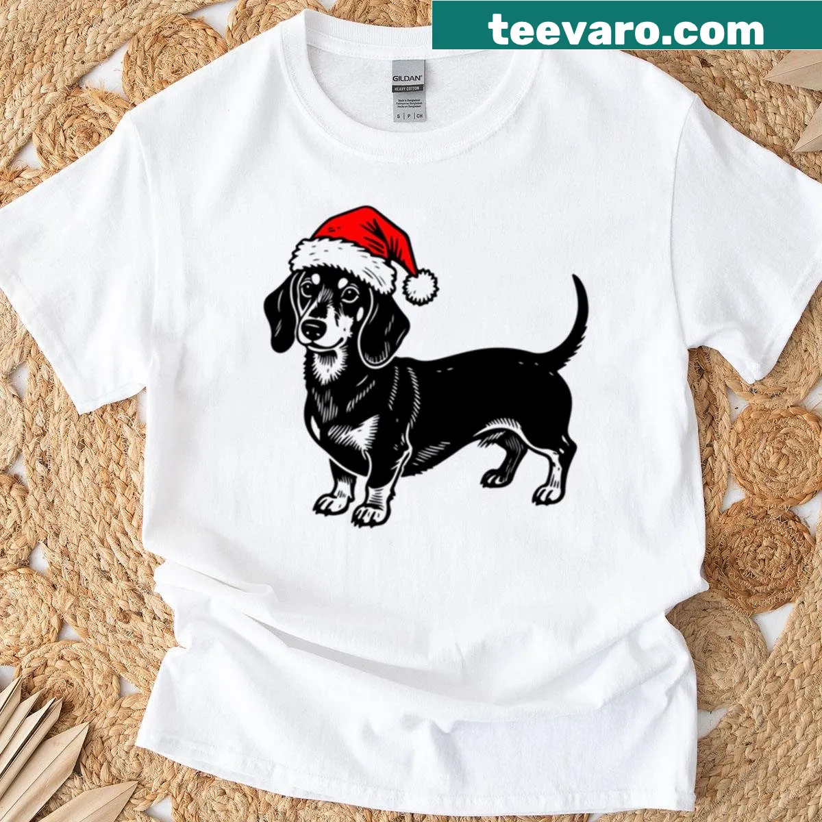 Christmas dachshund silhouette T-shirt with Santa hat design — on a men's t-shirt