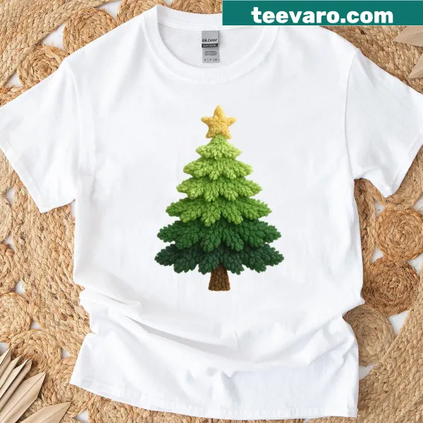 T-shirt featuring a dark green Christmas tree with a yellow star