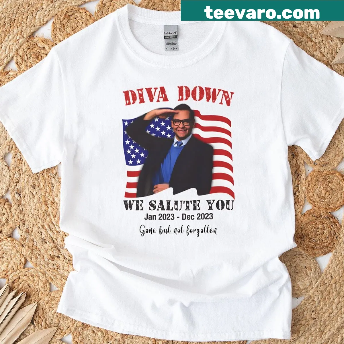 Funny T-shirt with 'Diva Down We Salute You George Santos' text — on a men's t-shirt