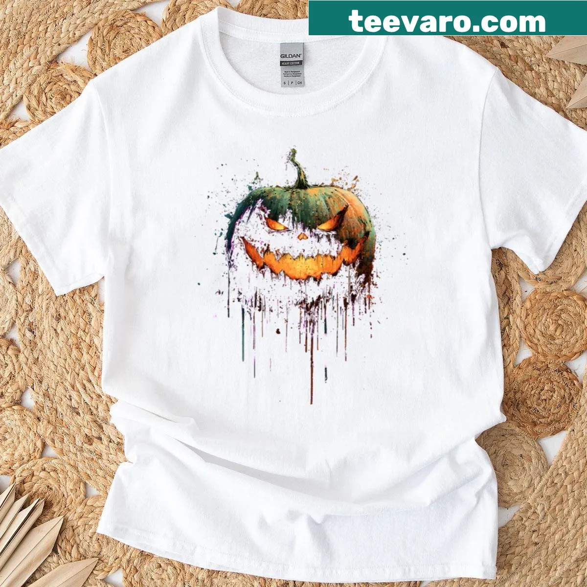 Grunge-style Evil Jack O Lantern with splatter art — on a men's t-shirt