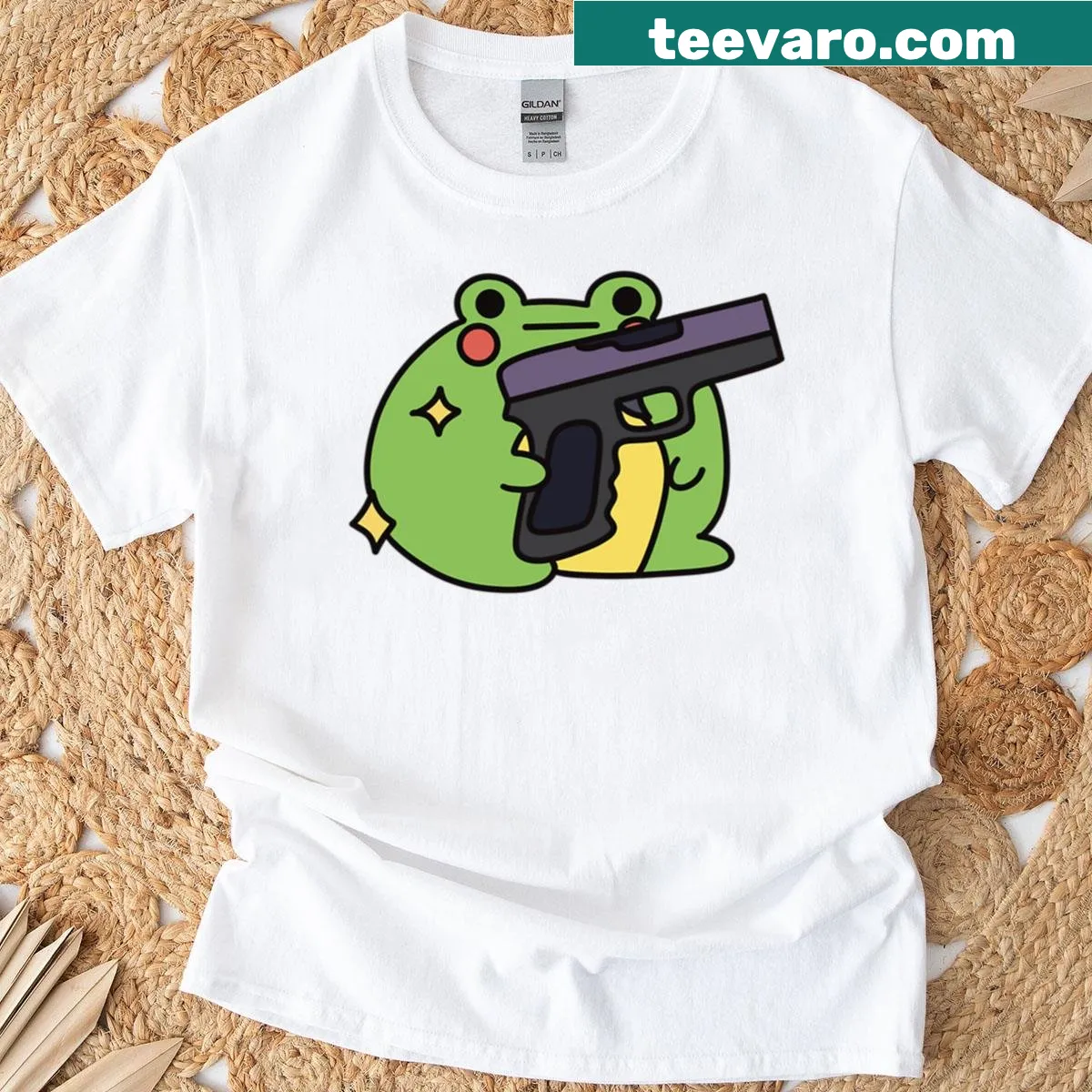 Cartoon t-shirt featuring a frog with a gun — on a men's t-shirt