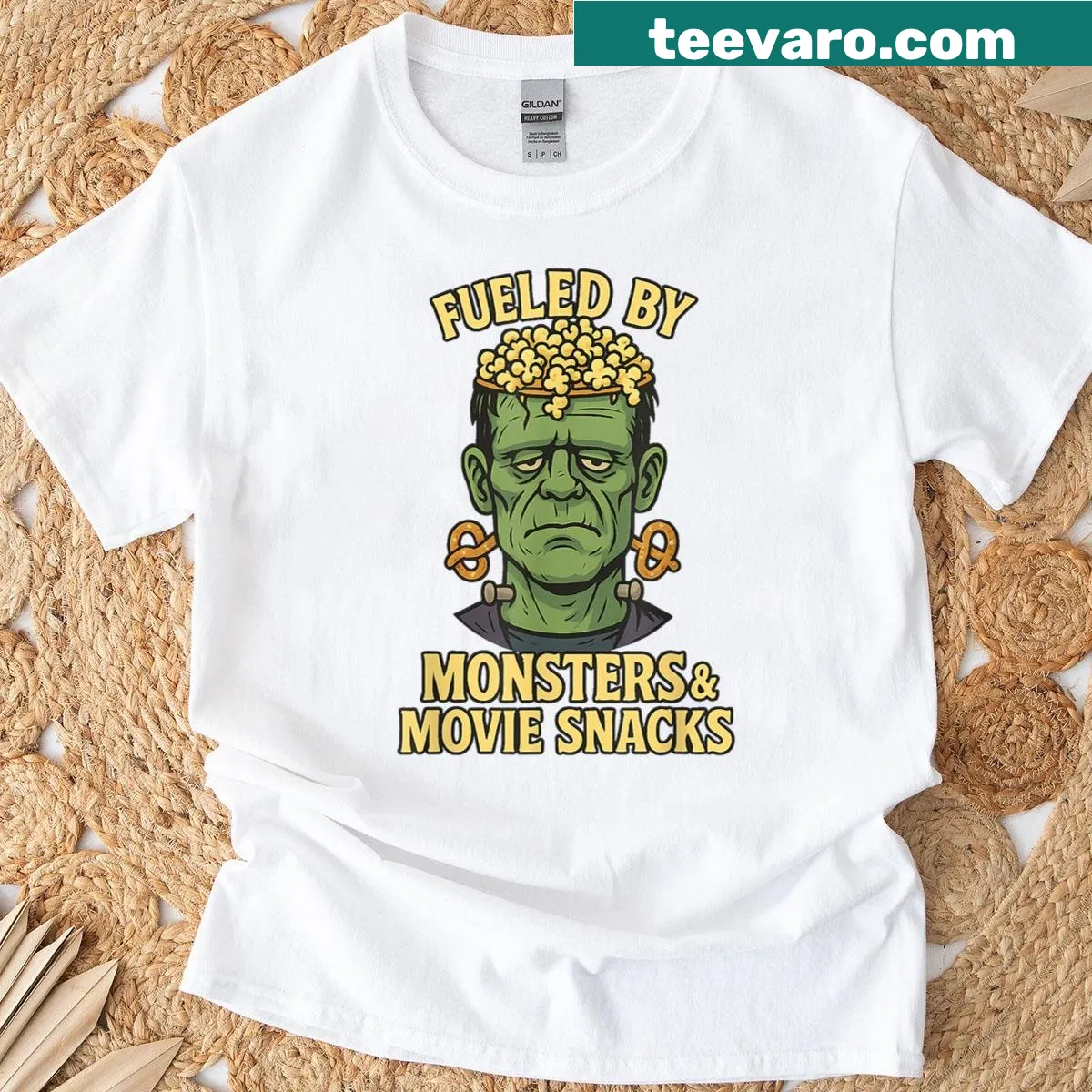 Funny Frankenstein cartoon enjoying movie snacks for Halloween — on a men's t-shirt