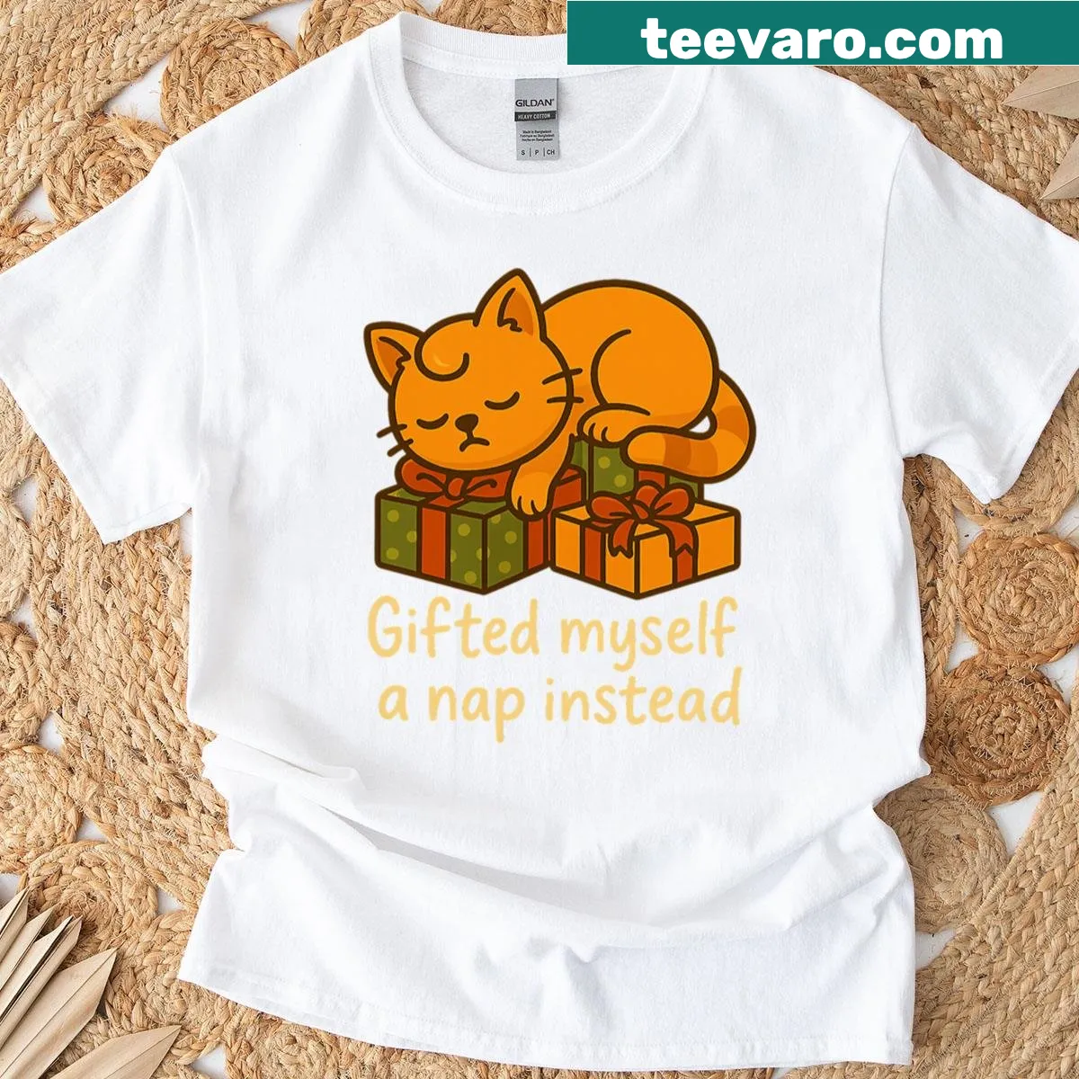 Christmas T-shirt featuring a cat sleeping on gifts — on a men's t-shirt