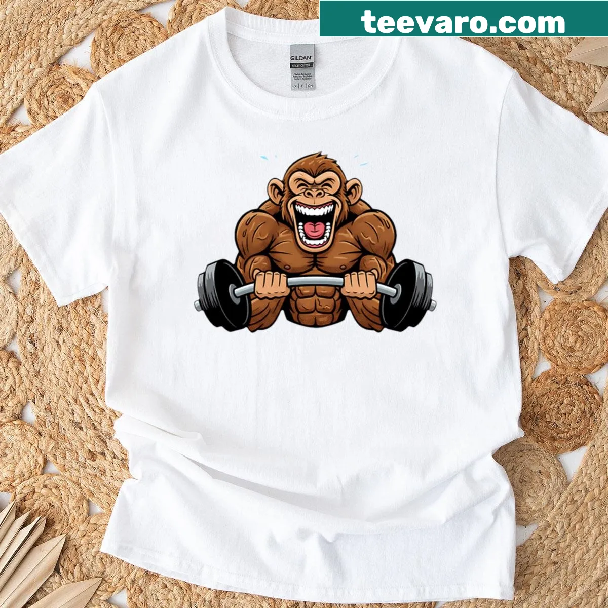 Cartoon monkey lifting weights graphic shirt — on a men's t-shirt