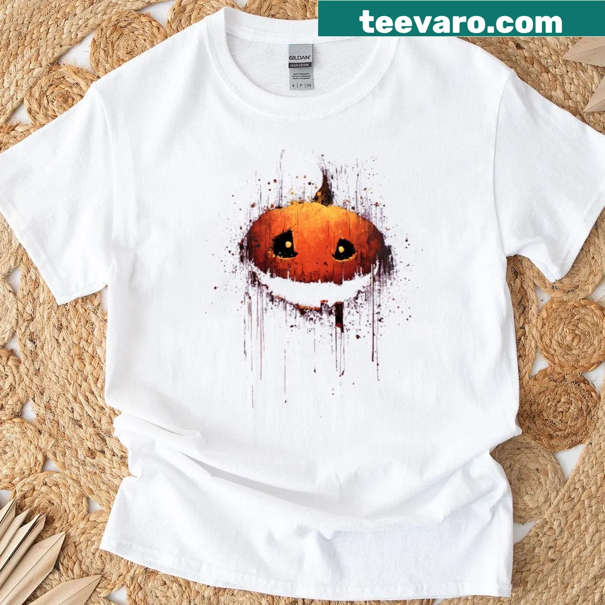 Smiling jack-o'-lantern with splatter art on a t-shirt — on a men's t-shirt