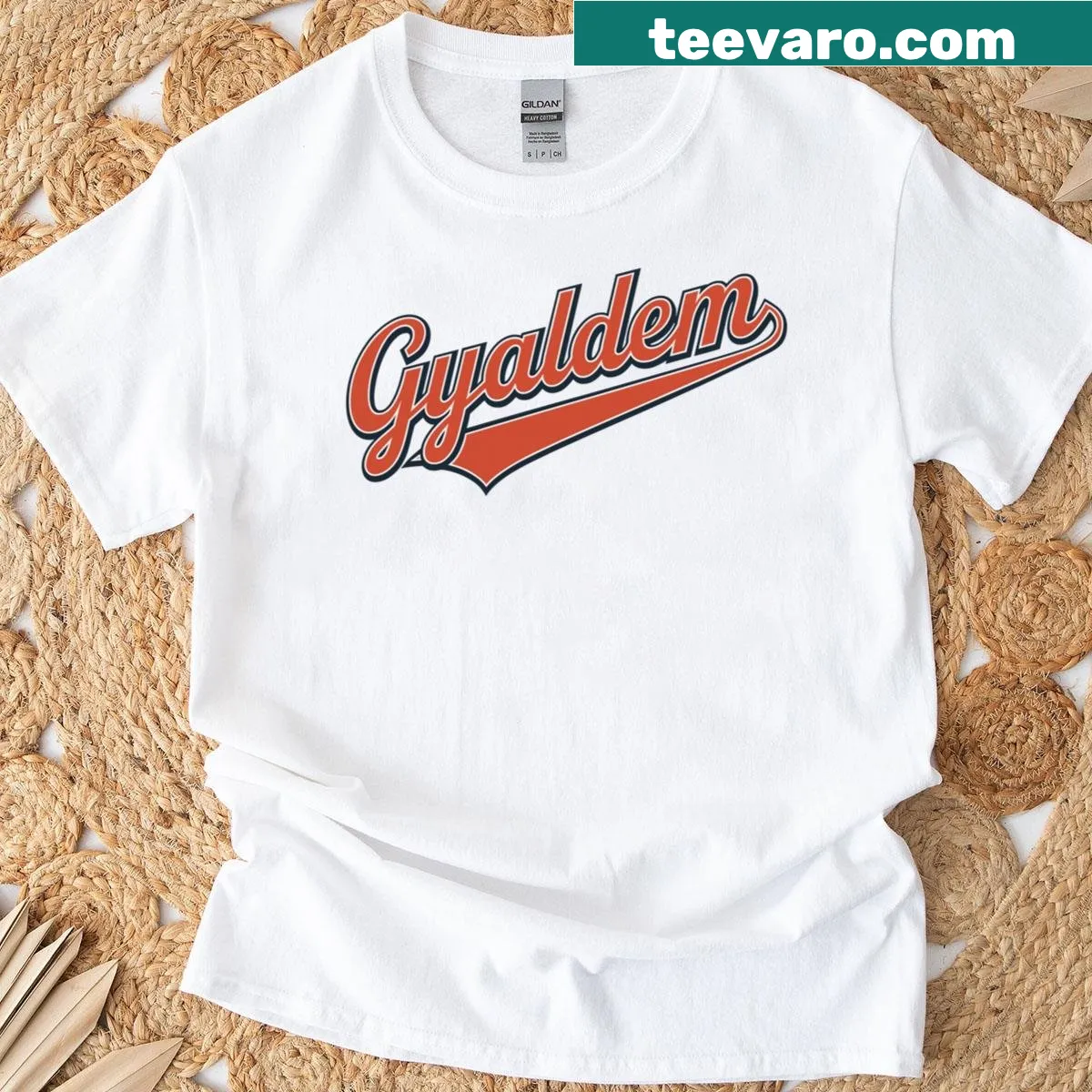 Caribbean slang sports logo t-shirt with Gyaldem script style design — on a men's t-shirt
