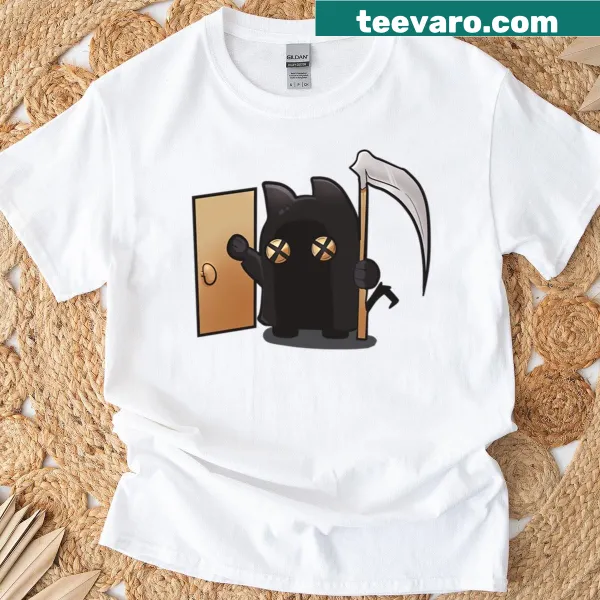 Eerie cat-themed graphic on a Halloween horror t-shirt.