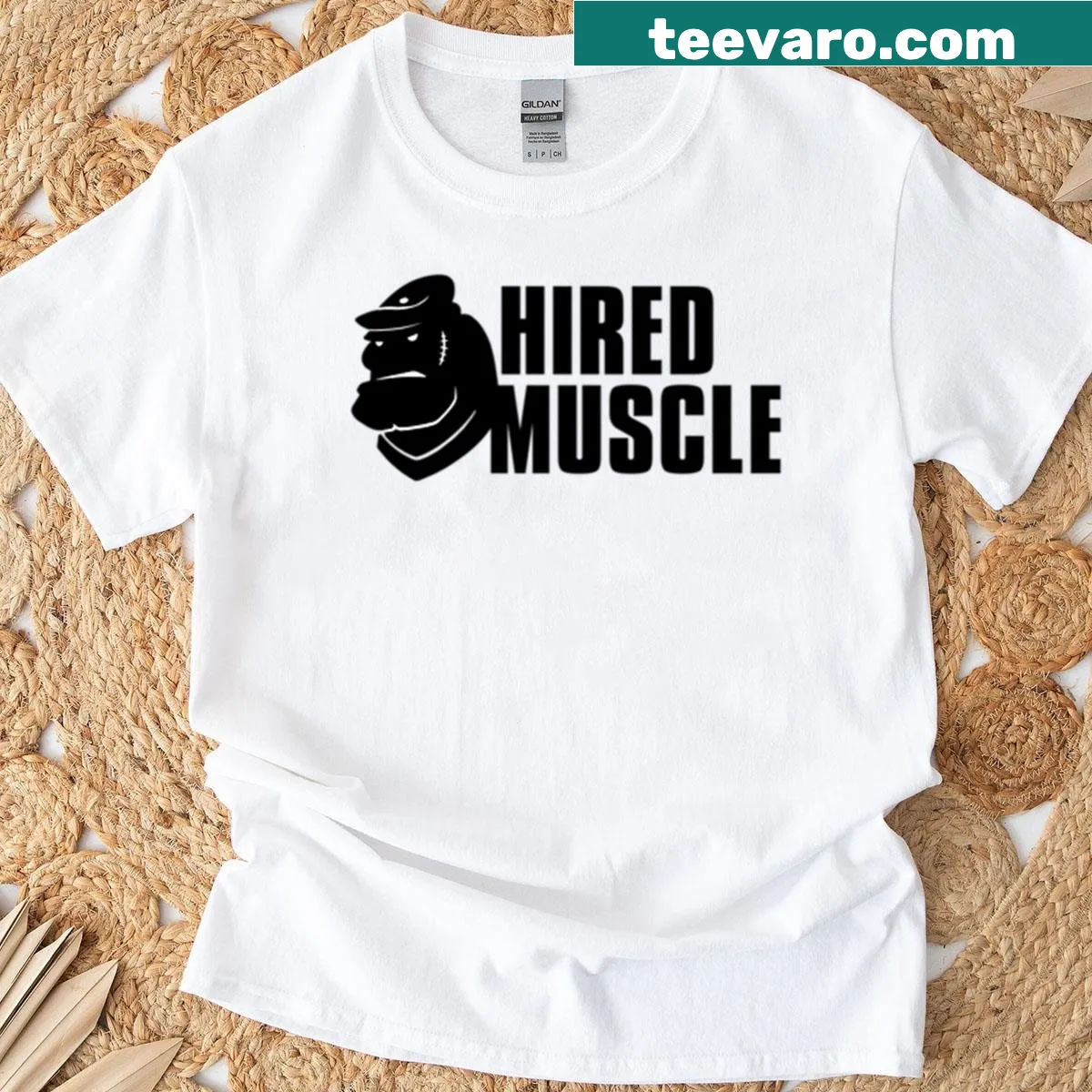 T-shirt featuring bold text 'Hired Muscle' celebrating strength — on a men's t-shirt
