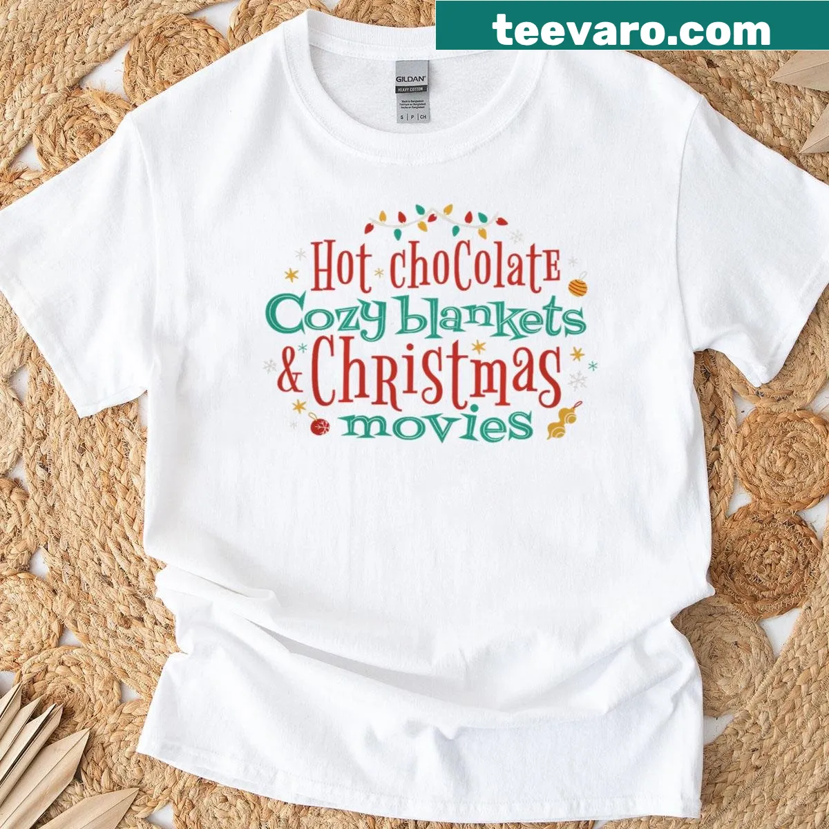 Cute graphic of hot chocolate and cozy blankets with Christmas themes — on a men's t-shirt