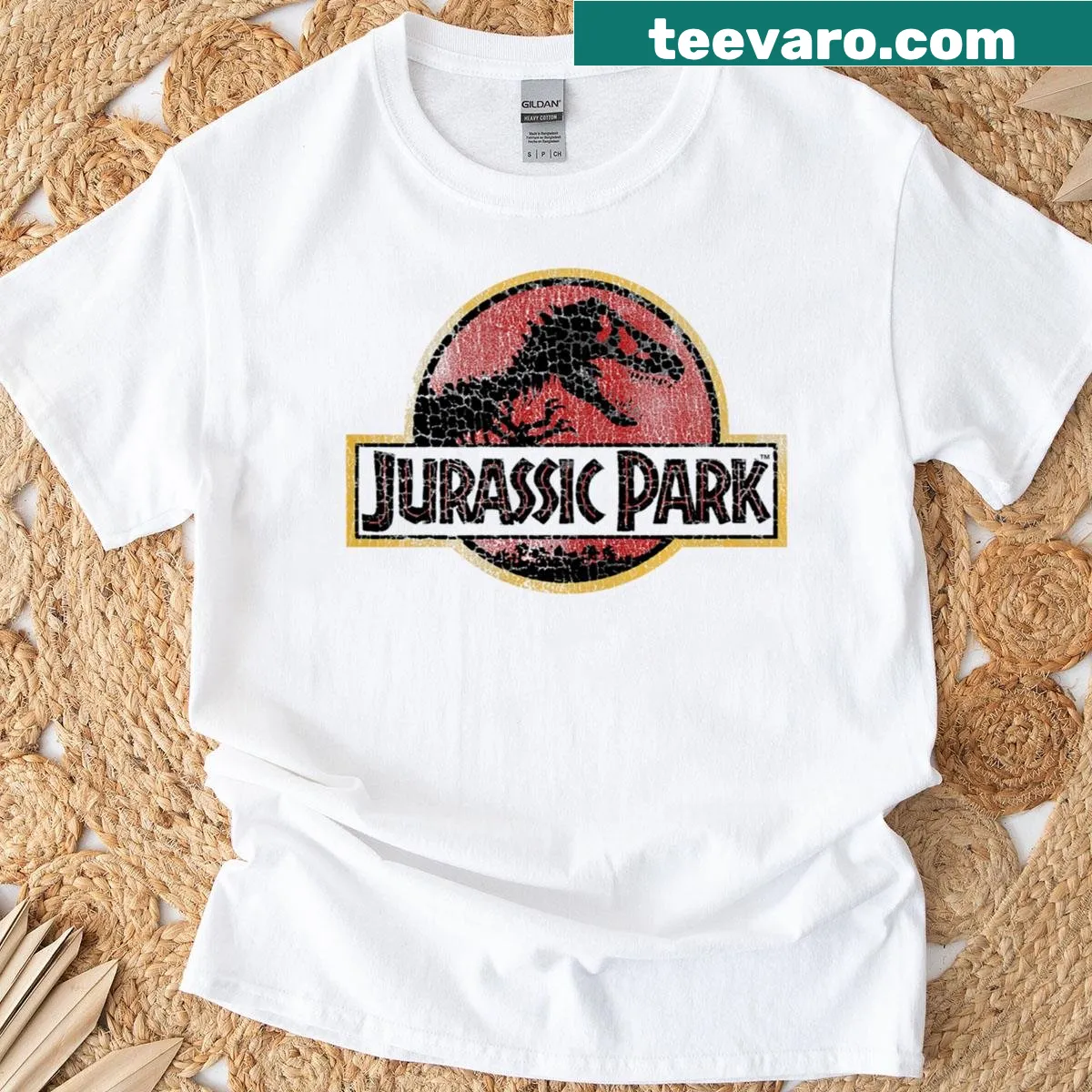 Vintage Jurassic Park t-shirt with cracked logo design — on a men's t-shirt