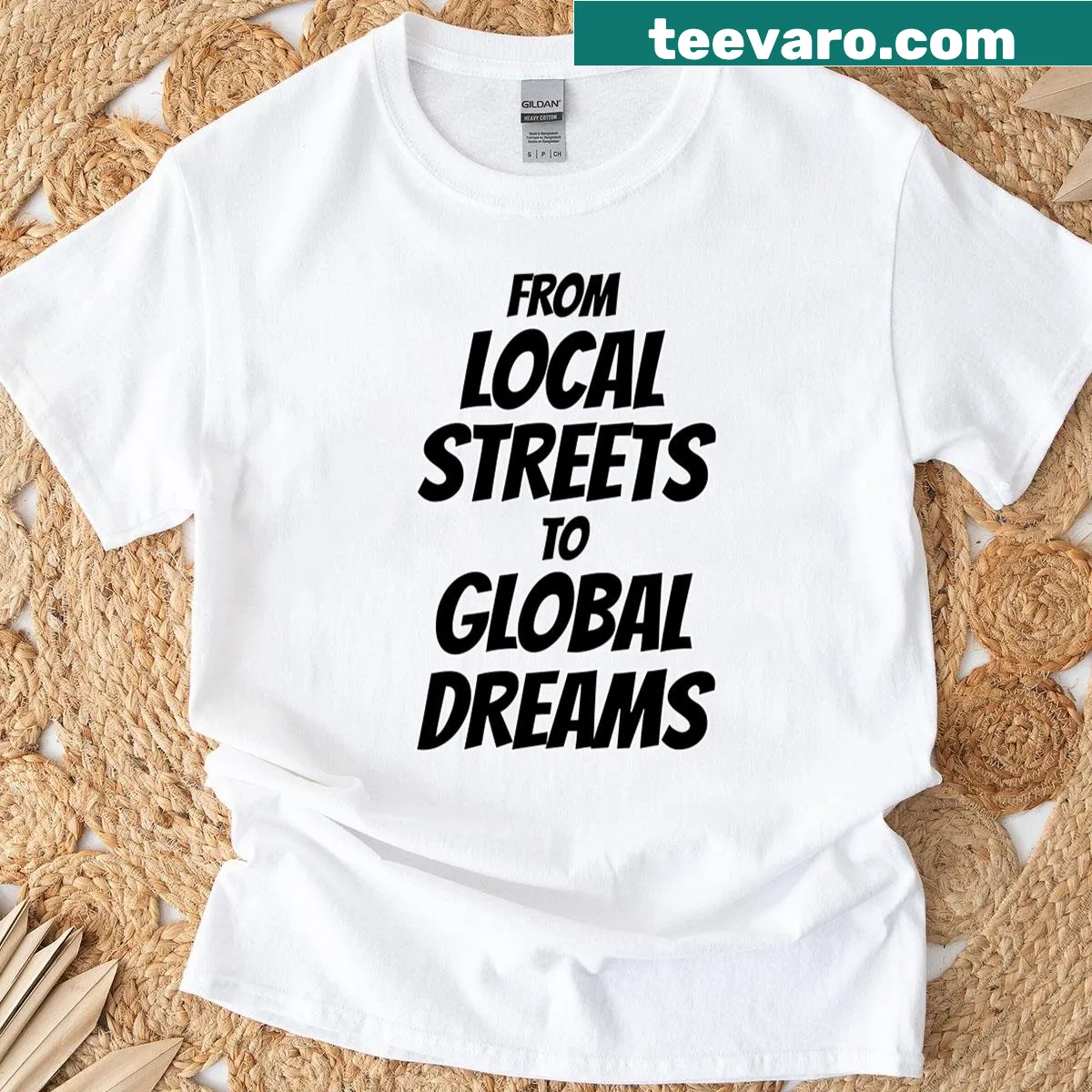 Typography shirt celebrating local roots and global aspirations — on a men's t-shirt
