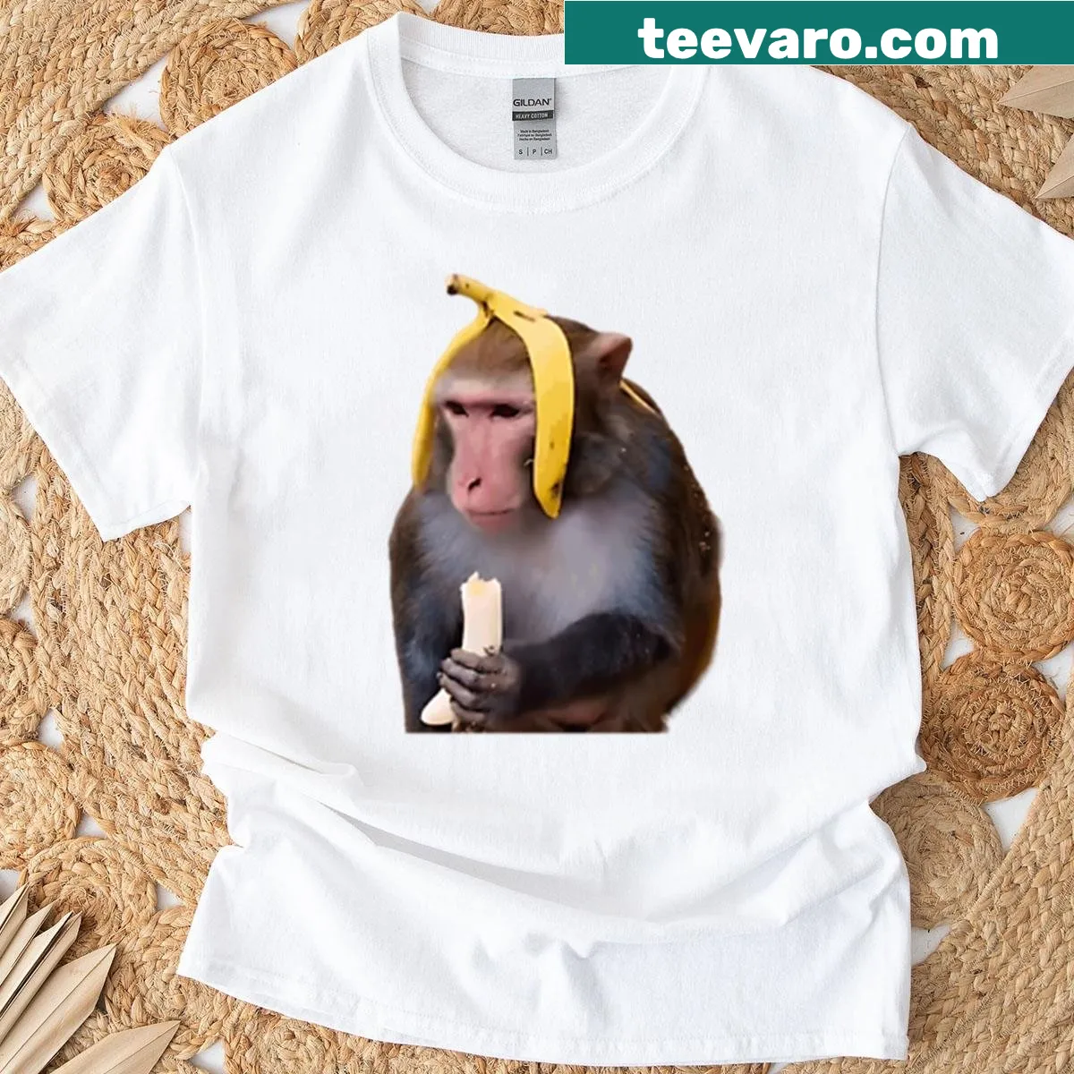 Cartoon monkey with a banana graphic on a T-shirt — on a men's t-shirt