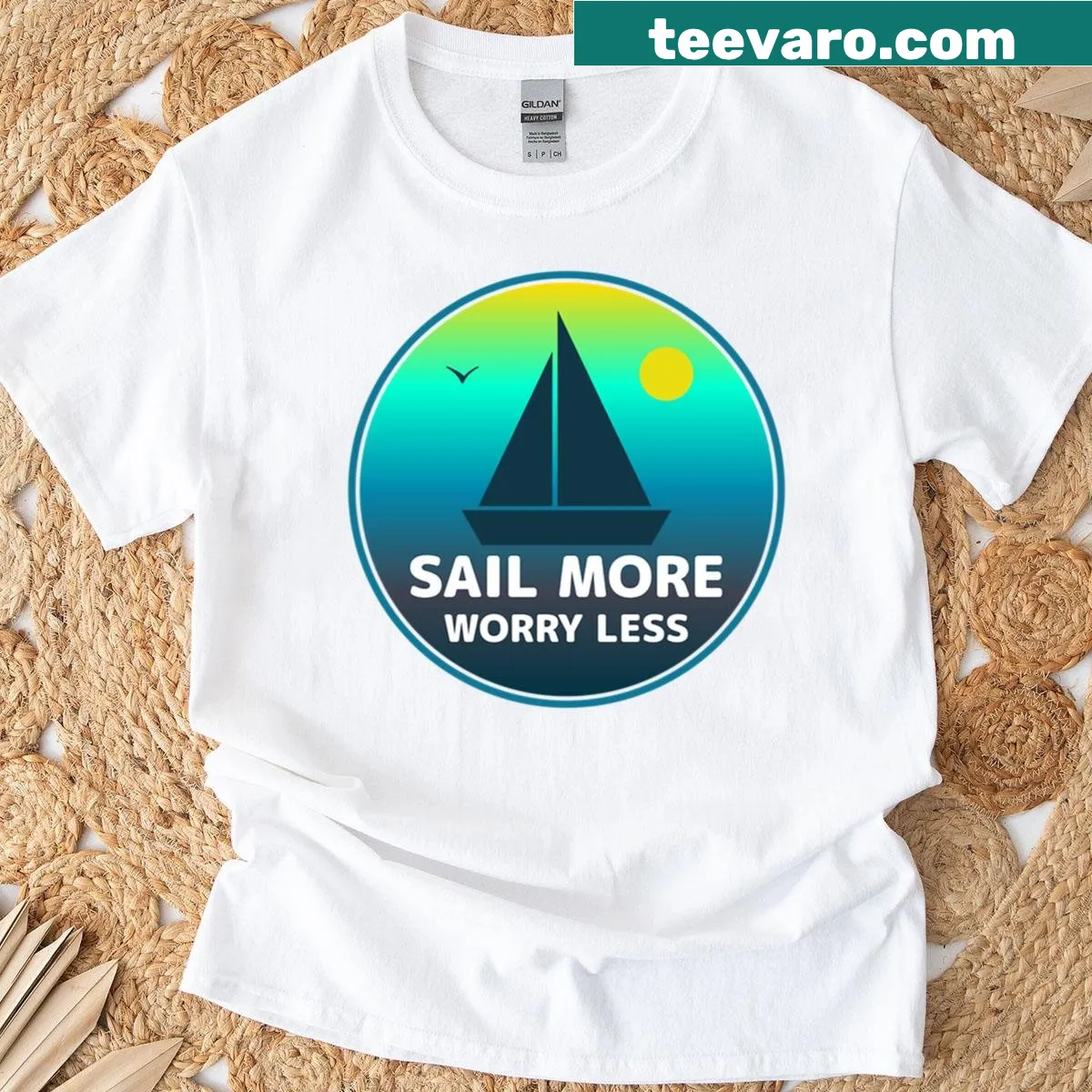 Minimalist sailing boat design with ocean sunset on a t-shirt — on a men's t-shirt