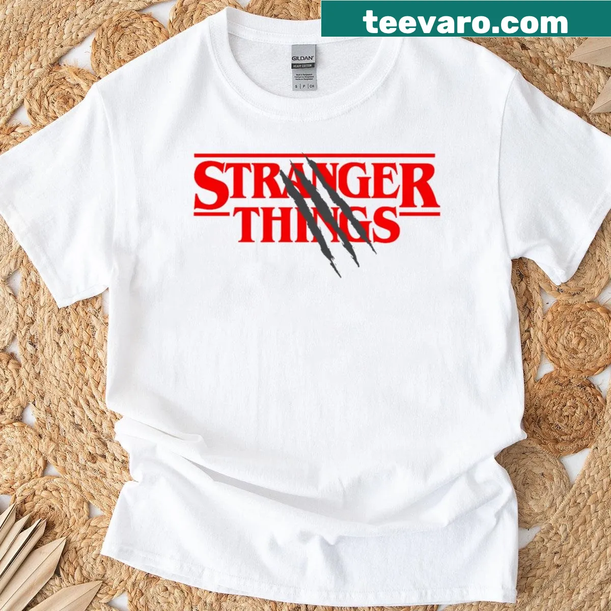 Stranger Things logo t-shirt with claw marks design — on a men's t-shirt