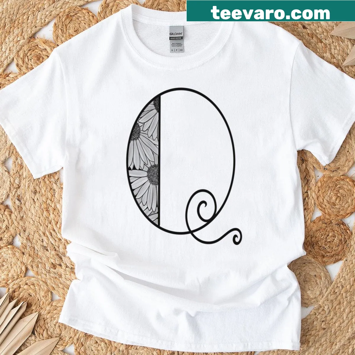T-shirt with sunflower-inspired letter Q design — on a men's t-shirt