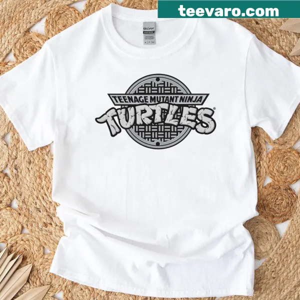 Vintage distressed TMNT sewer logo graphic on t-shirt
