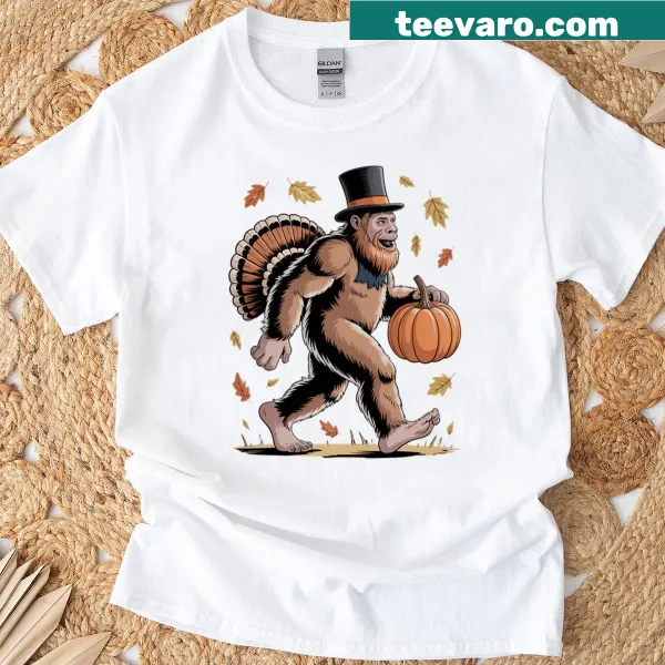 Whimsical Bigfoot holding a pumpkin illustration on a Thanksgiving shirt