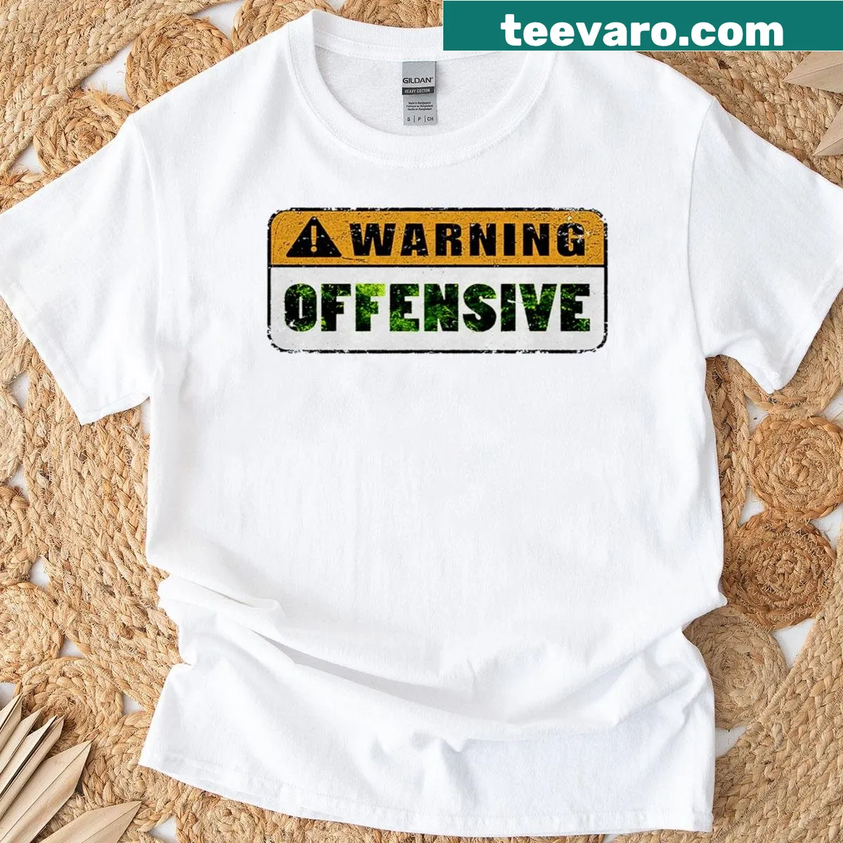 Vintage distressed tee with 'Warning Offensive' text — on a men's t-shirt