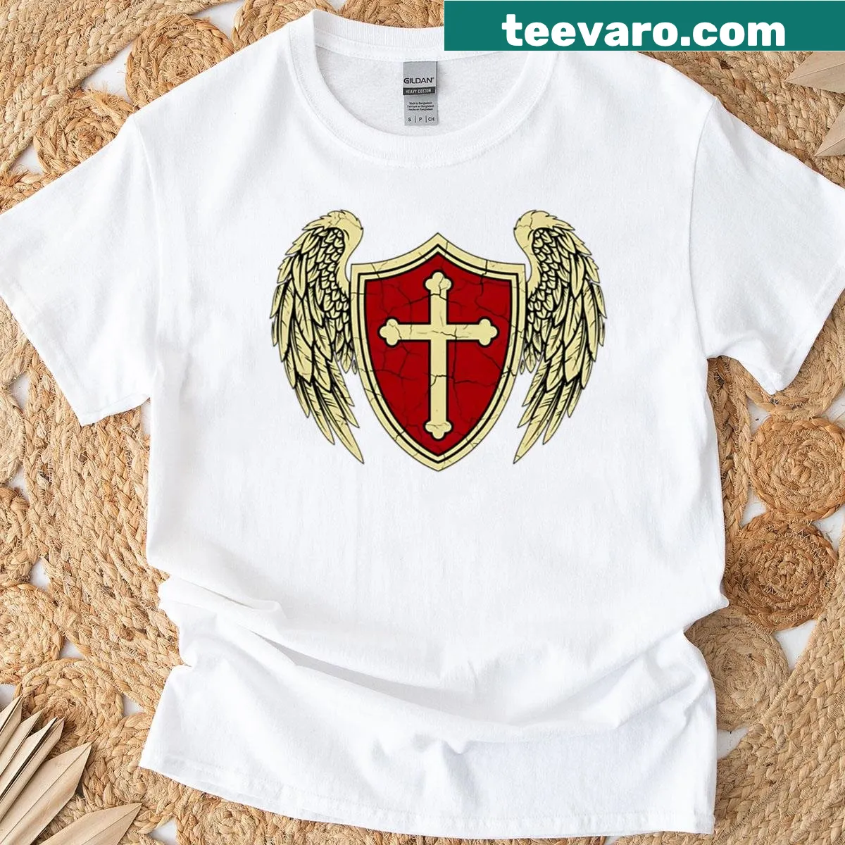 T-shirt with winged shield and cross design — on a men's t-shirt