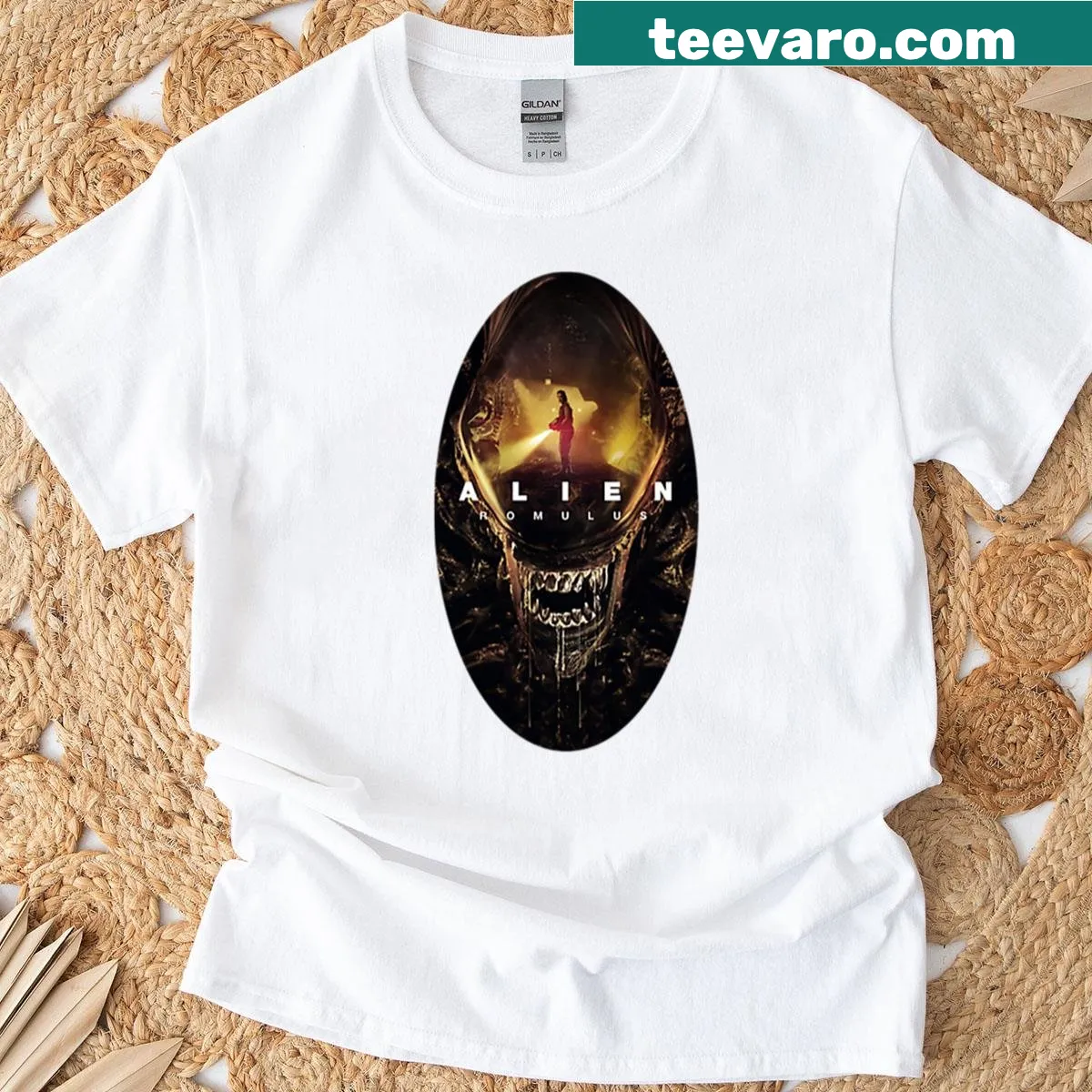 T-shirt with an oval design featuring a stylized alien graphic — on a men's t-shirt