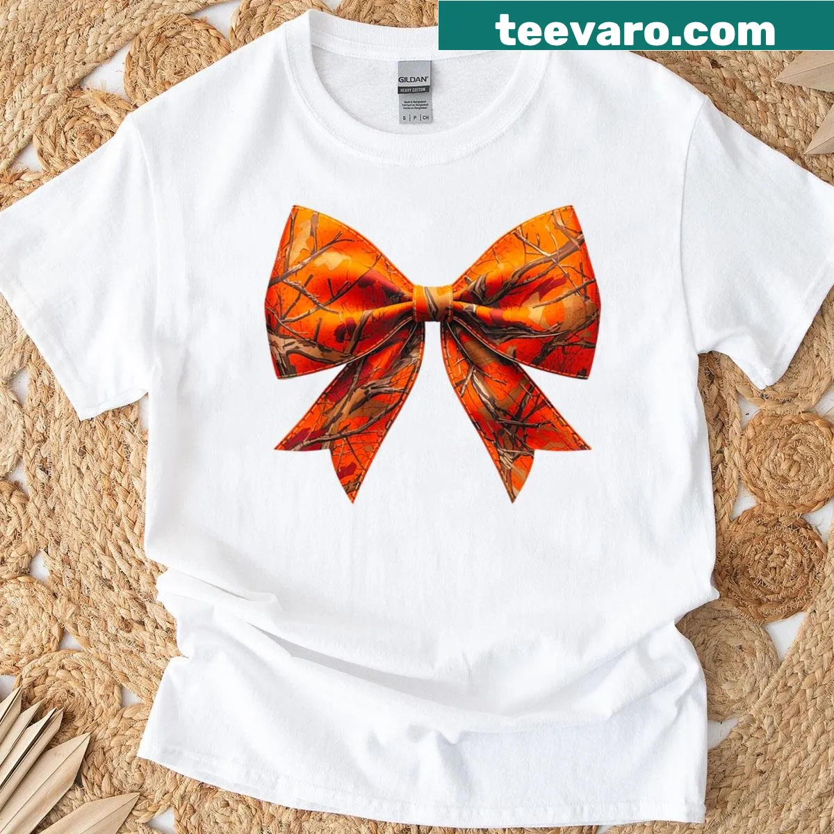 Camo T-shirt featuring a playful bow design for women. — on a men's t-shirt