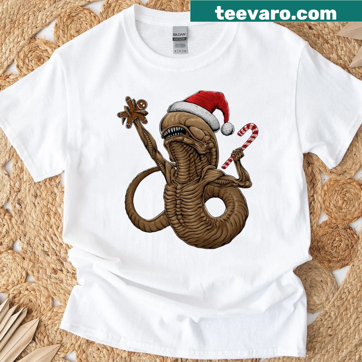 Oversized Christmas T-shirt featuring a cartoon chestburster design — on a men's t-shirt