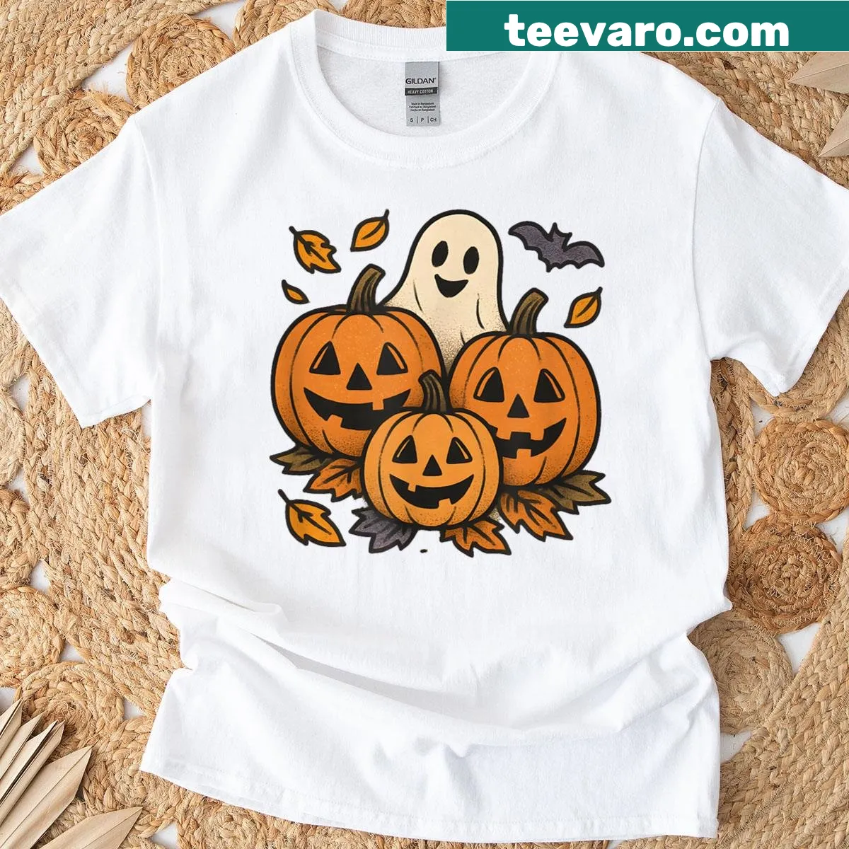 Cute Halloween scene with pumpkins, ghosts, and bats on T-shirt — on a men's t-shirt