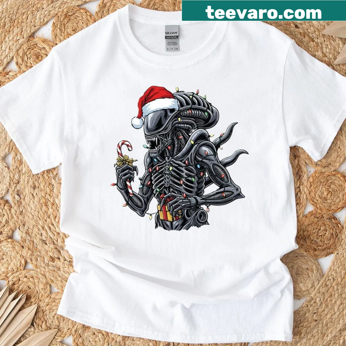 Cute T-shirt featuring a festive alien with a Santa hat in cartoon style — on a men's t-shirt