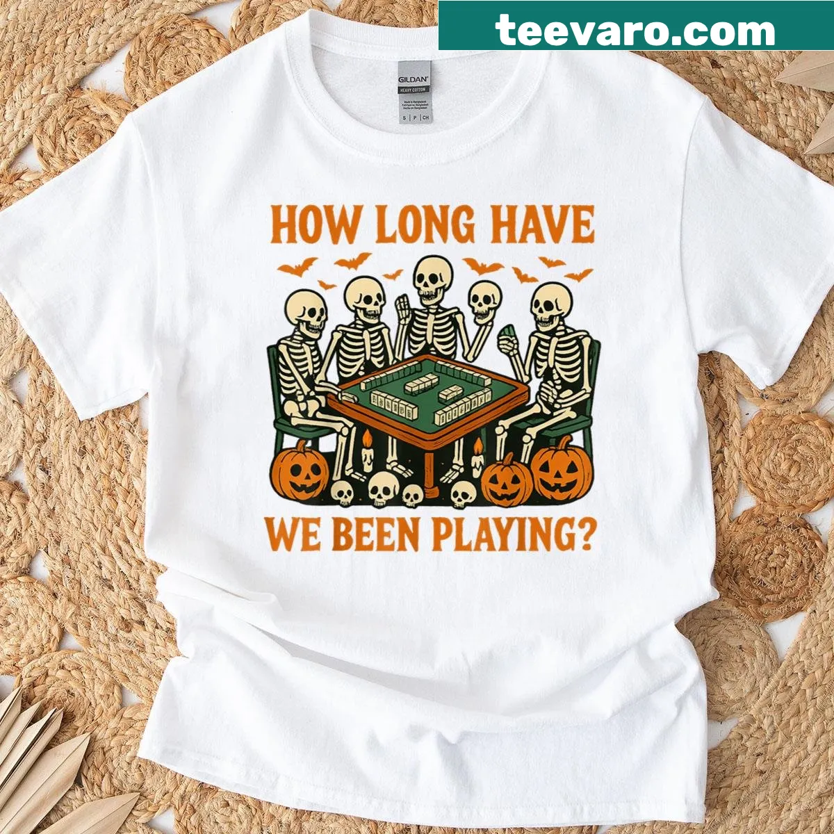 Halloween t-shirt featuring a skeleton playing Mahjong — on a men's t-shirt