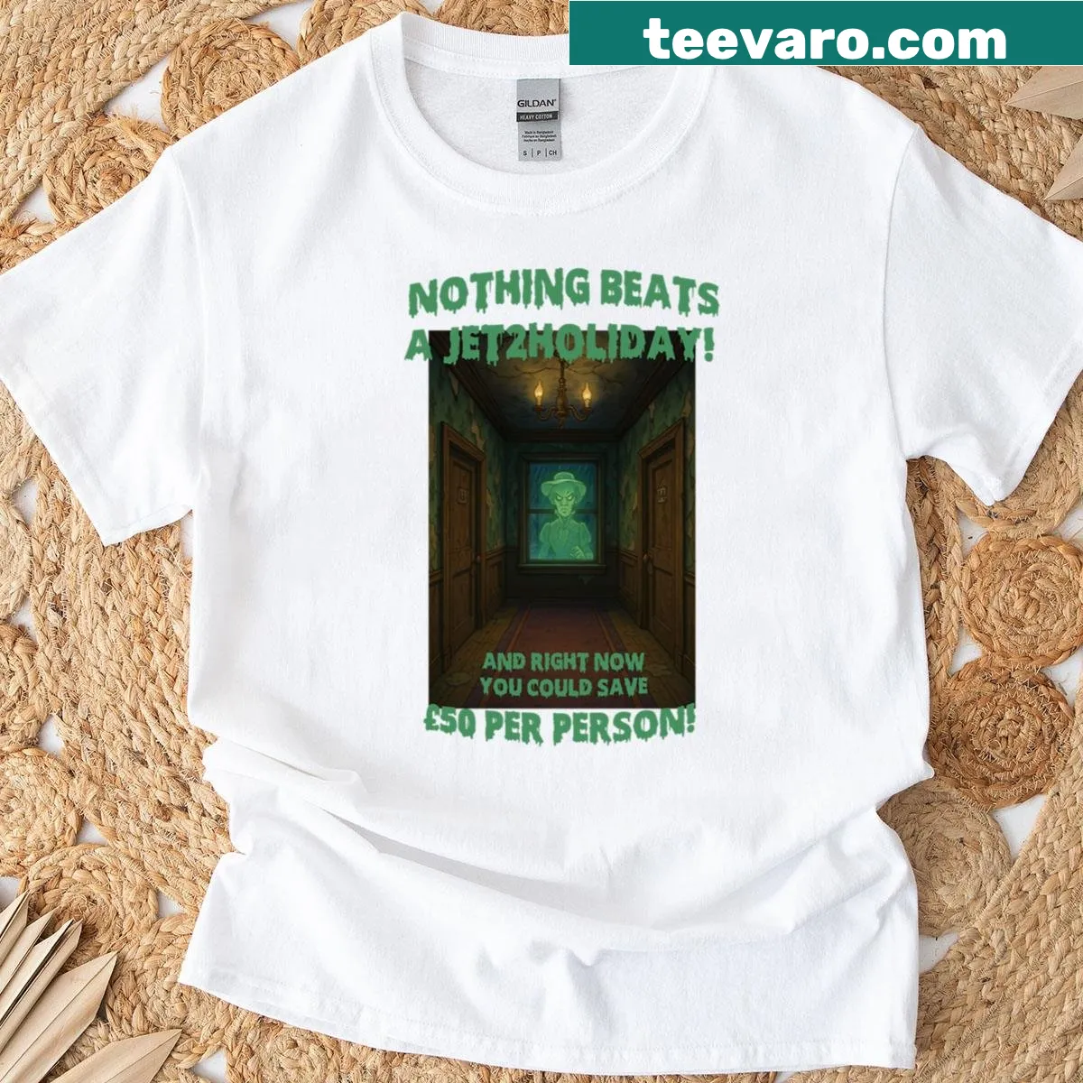 Haunted Halloween Hotel graphic T-shirt with ghosts and spooky architecture — on a men's t-shirt