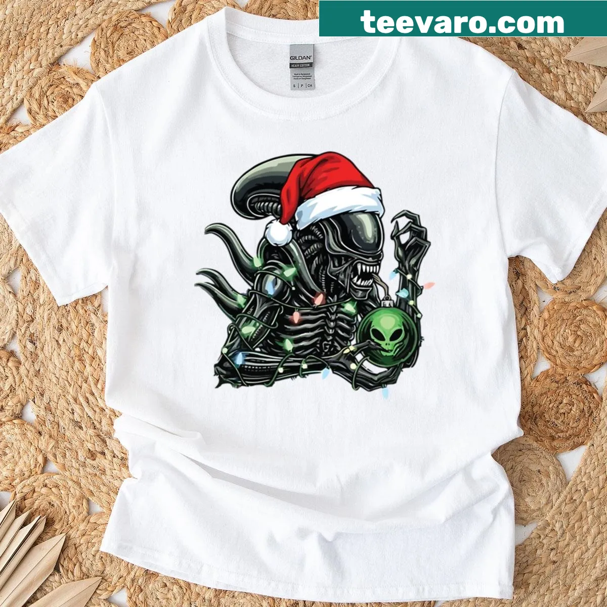 Funny alien in Santa hat surrounded by lights on T-shirt — on a men's t-shirt