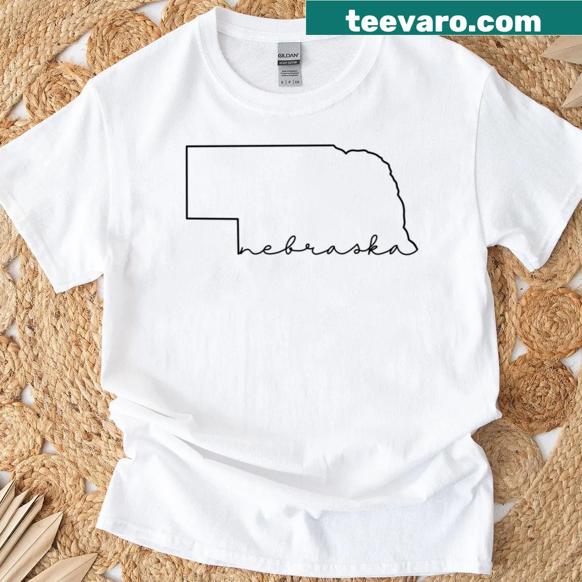 Minimalist Nebraska design on a black oversized T-shirt — on a men's t-shirt