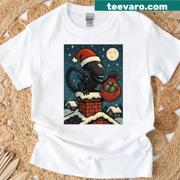 Humorous Christmas shirt featuring a Santa Xenomorph in a chimney