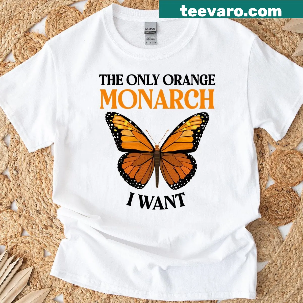 Emblematic T-shirt featuring orange monarch butterfly design for feminists — on a men's t-shirt